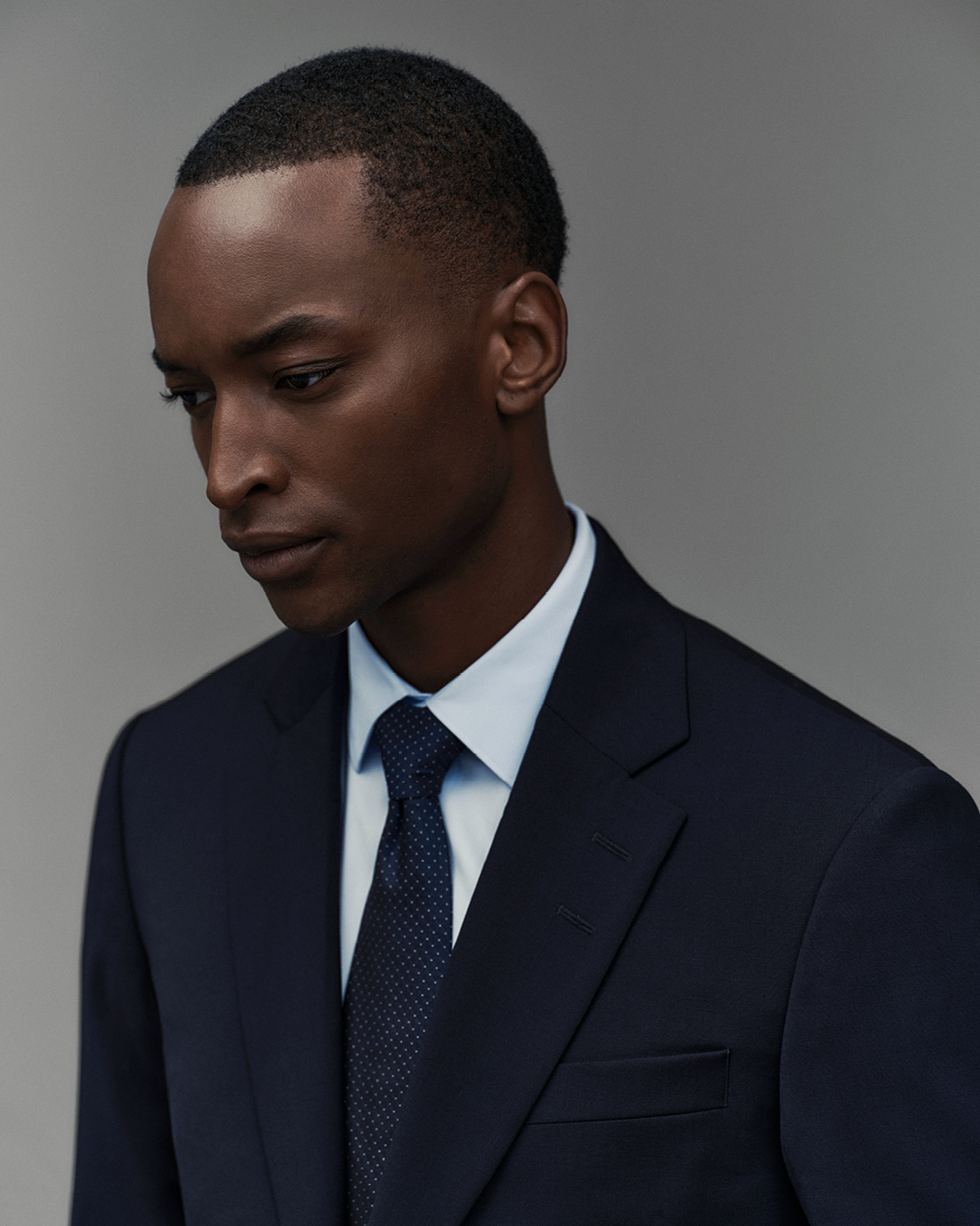 Man in blue shirt and black tie